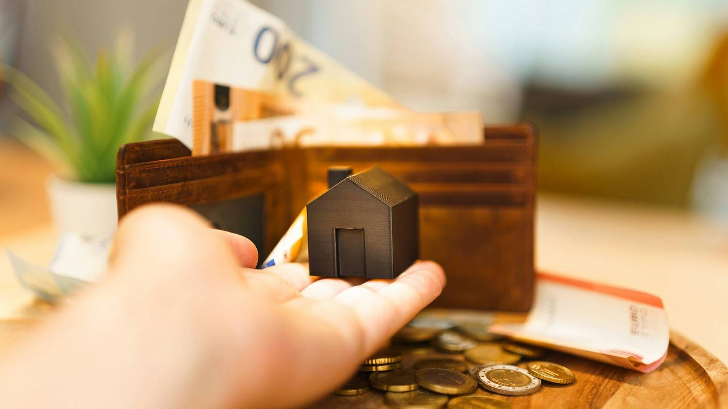 Money and house model — “Refinancing and mortgage advice from Home Ease Mortgages Canada.”