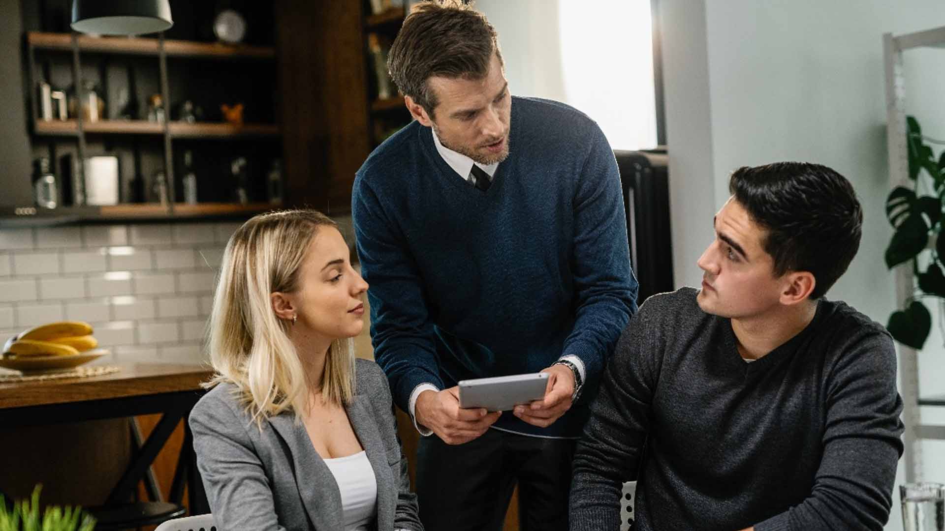 man explaining rates to couple