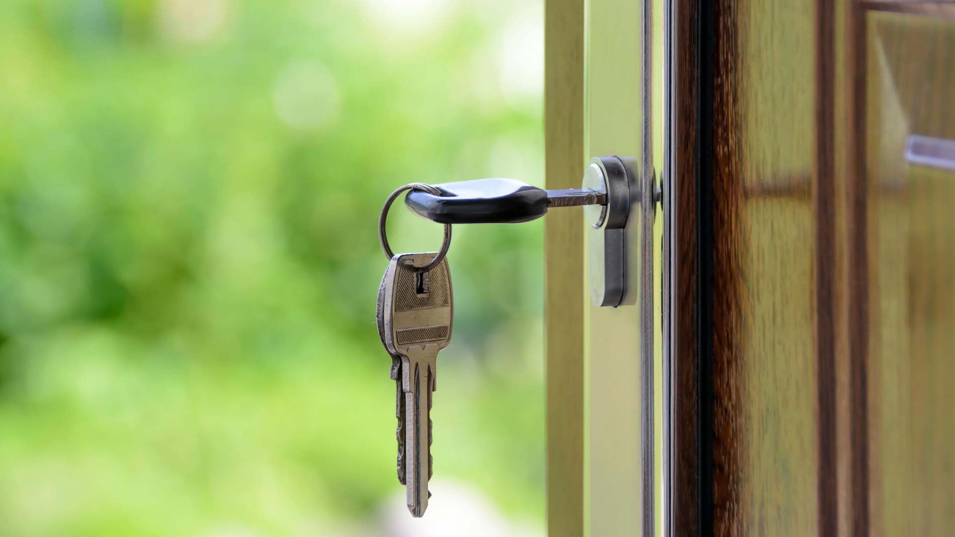 Keys in door lock — “Helping first-time buyers unlock their dream homes.”